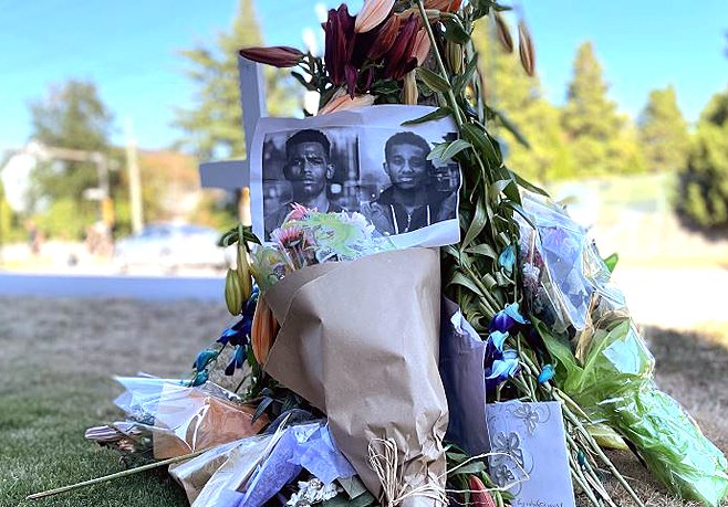 A memorial on 10th Avenue near Sixth Street paid tribute to Samir Ali, 18, and Yasbirat Ytatek, 17, who were killed in a crash in July 2022.