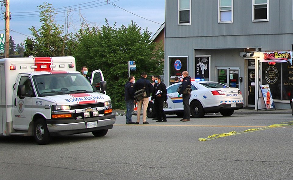 Emergency crews respond to a fatal gangland shooting that killed one man and injured another in Burnaby on May 8. 