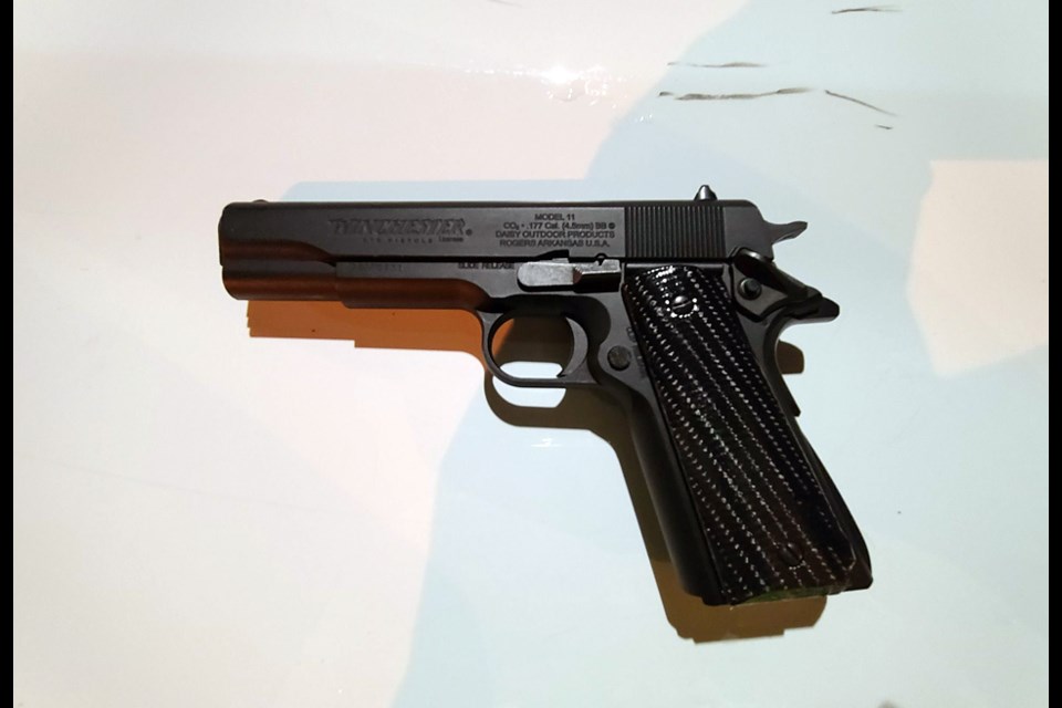 A driver arrested for drunk driving Sunday was carrying this replica handgun in his hoodie pocket, according to police. 