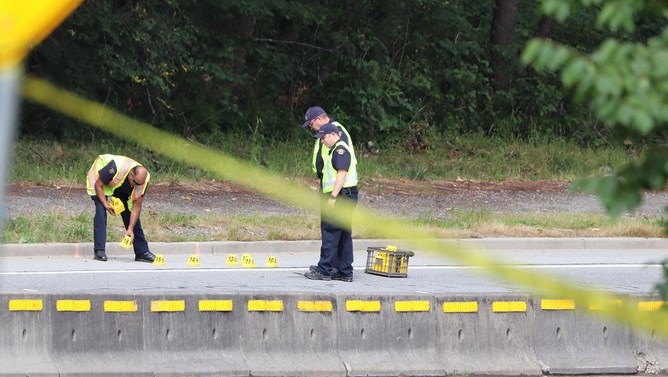 Police investigators examine the scene after the fatal hit-and-run that killed 53-year-old cyclist and father of two Charles Masala on Gaglardi Way on June 29, 2019.