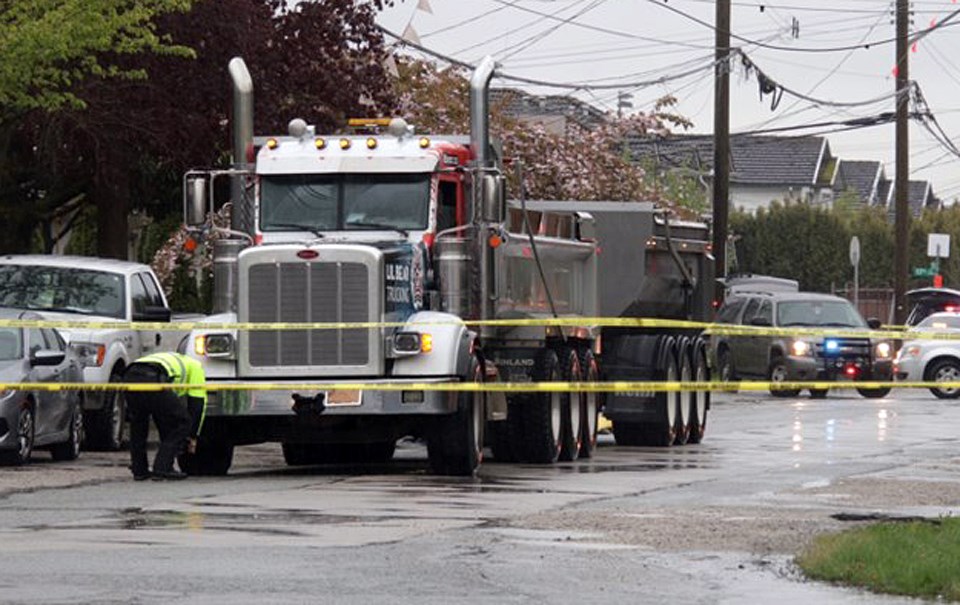 Police investigate a fatal collision involving a dump truck that killed a 14-year-old girl at 11th Avenue and 16th Street Thursday.