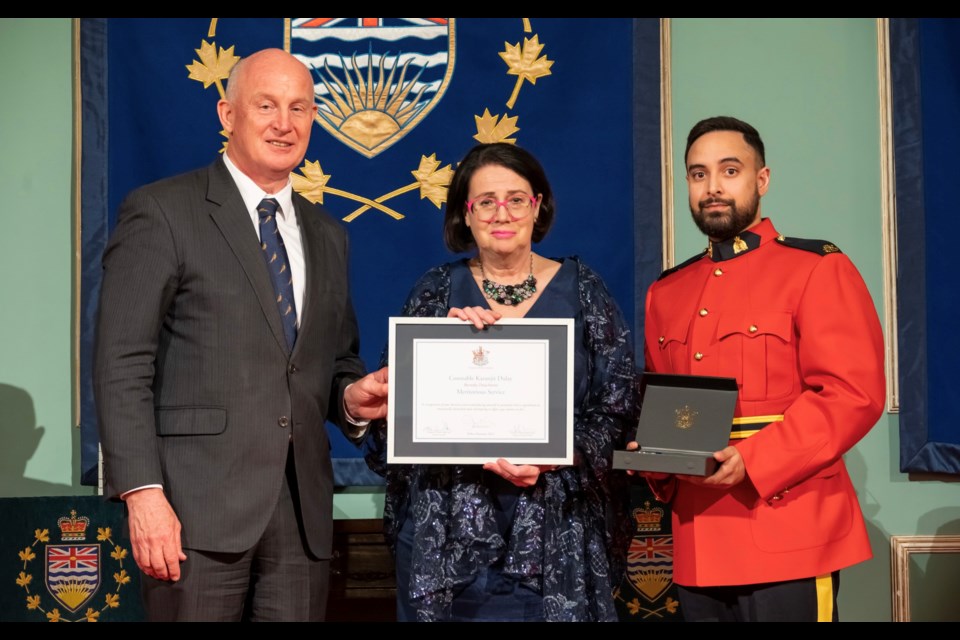 Public Safety Minister Mike Farnworth and Lieutenant Governor Janet Austin present an award to Burnaby RCMP Const. Karanjit Dulay last month.