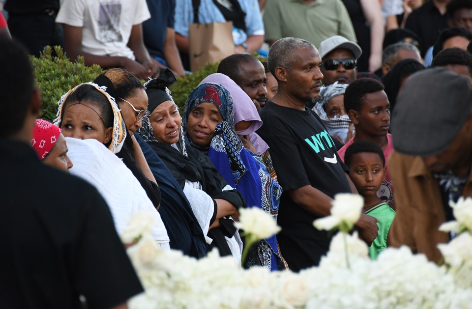 Family members of two teens killed in a car crash on the Burnaby-New West border last week grieve at a vigil on 10th Avenue in Burnaby Monday.