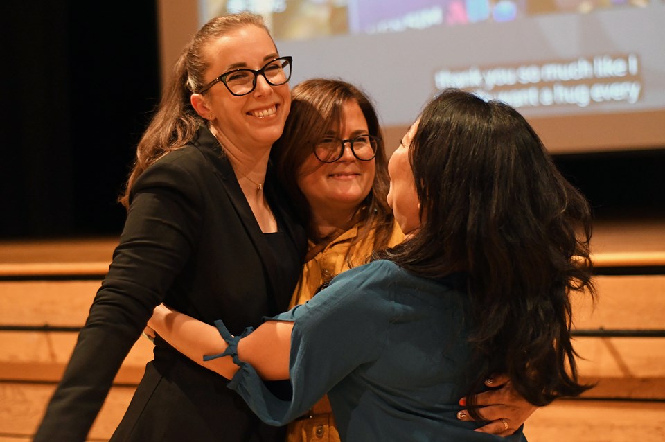 From left, trustees-elect Kristin Schnider, Mikelle Sasakamoose and Jen Mezei celebrate a Burnaby Citizens Association sweep of school board during Saturday's municipal elections. 