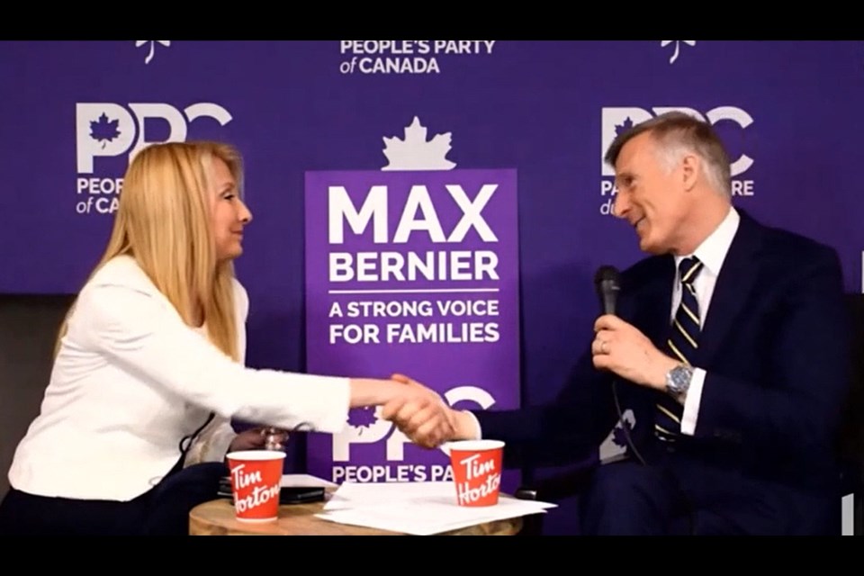 Laura-Lynn Tyler Thompson shakes hands with Canadian People's Party leader Maxime Bernier during a campaign event in May.