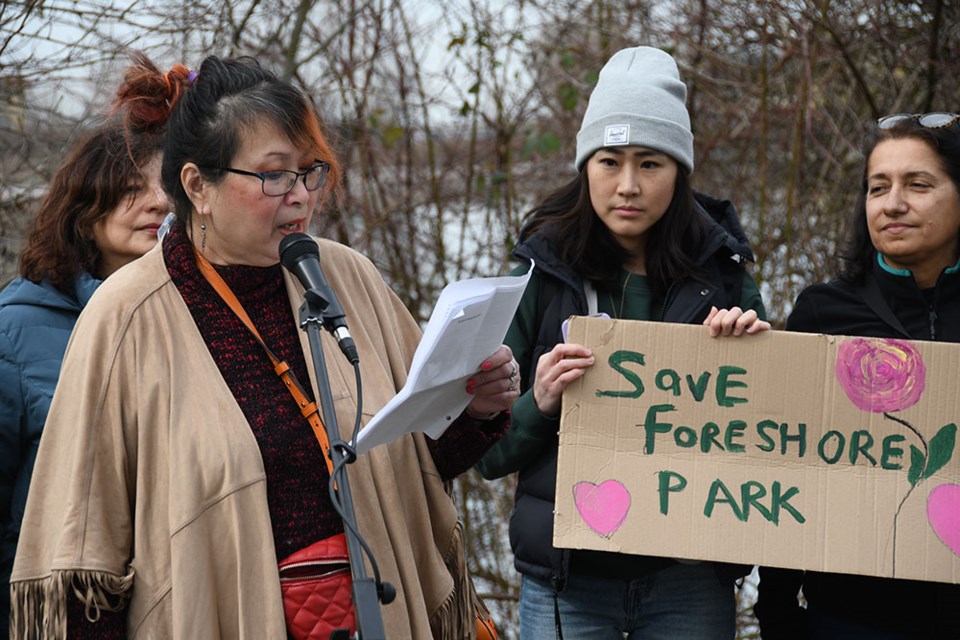 Burnaby resident Cynthia Chan, rally organizer, speaks against the proposed compost facility and preservation of the wetlands at Fraser Foreshore Park.