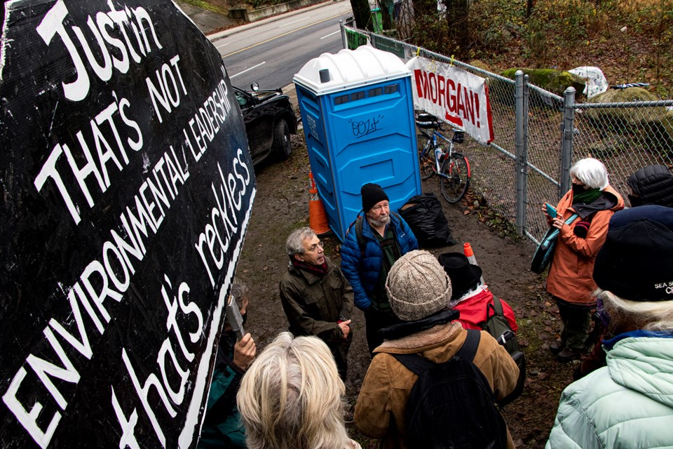 Yvon Raoul (left) and Earle Peach address their supporters after receiving $150 fines for trespassing on CN Rail property in protest against the Trans Mountain pipeline expansion on Dec. 10, 2020. Photo via Dustin Godfrey/Burnaby Now