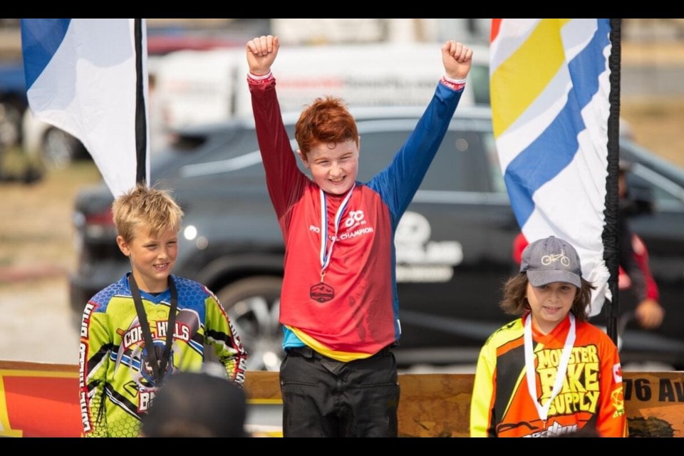Leonardo Leavy, 10, at the top of the podium for the race he won to qualify for the 2022 BMX World Championships in France.