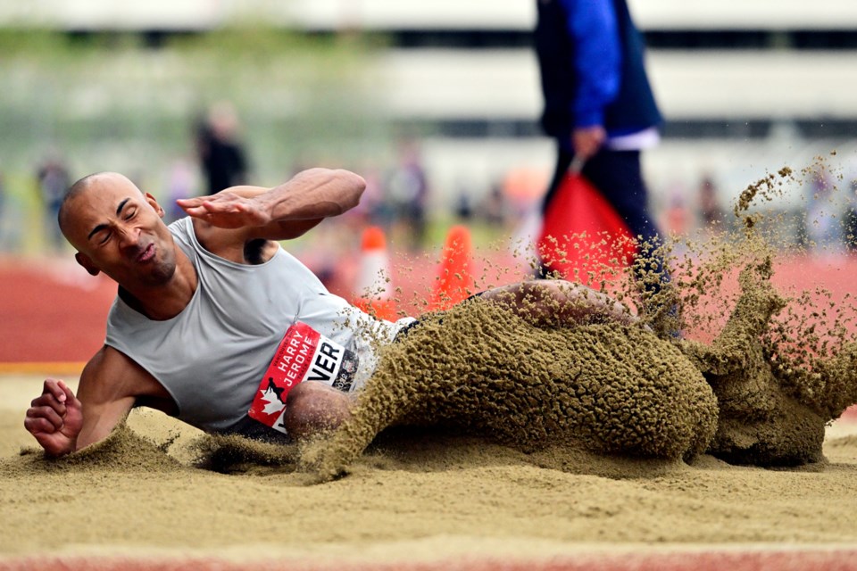 Olympic gold medalist Damian Warner hits the sand during the long jump competition at the 2022 Vancouver Sun Harry Jerome Track Classic at Swanguard Stadium. 