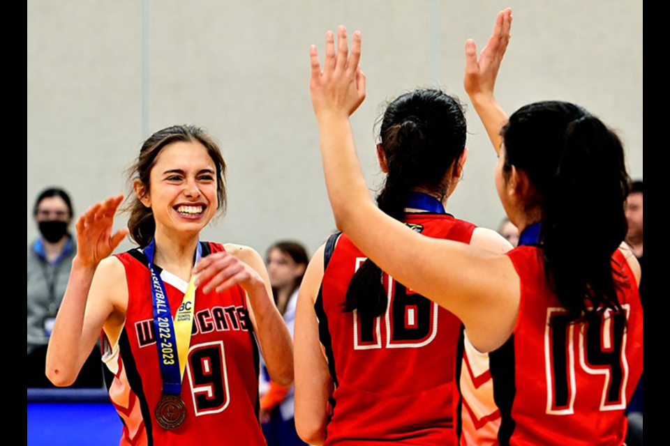 Burnaby Central Wildcats forward Valentina Brida (#9) celebrates with her bronze medal. 