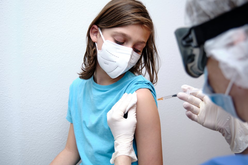 Child getting COVID vaccine