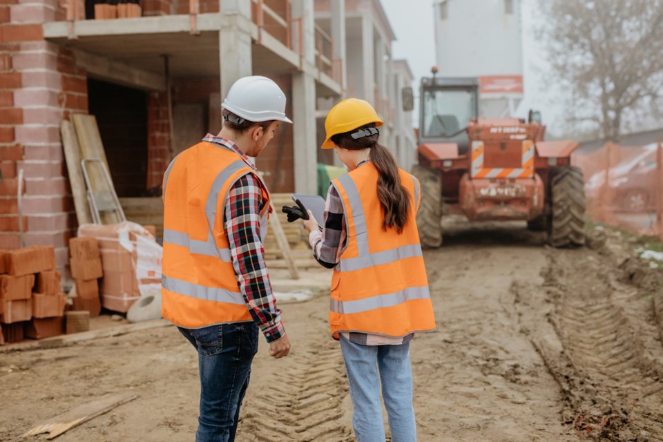 Woman and man on work site
