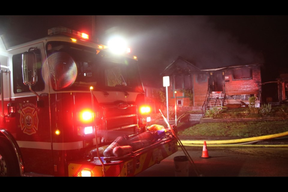 Flames were shooting out of the roof and windows when New Westminster firefighters arrived at this Wilson Street residence about 3 a.m. on Monday, Jan. 18. The house, which had been abandoned, will be demolished and searched to ensure it was unoccupied at the time of the fire.