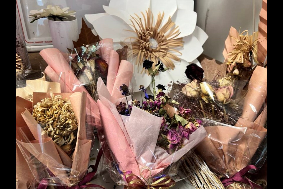 Jennifer Yoon of Mountain Village Market makes handmade paper flowers on display. Photo Abhinaya Natesh 