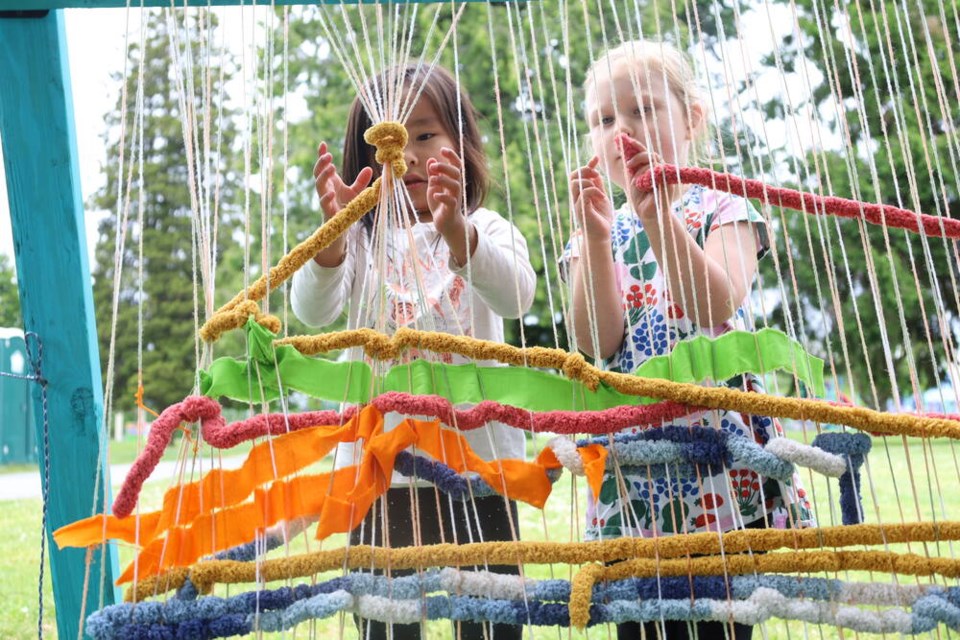 web1_four-year-old-sarenity-desjarlais-cahoose--left--and-timea--right--weave-at-national-indigenous-peoples-day-in-burnaby
