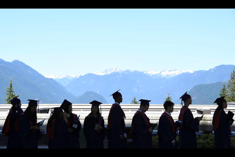 SFU graduands wait for the procession to begin before their convocation. Photo Lauren Vanderdeen/Burnaby Now. 