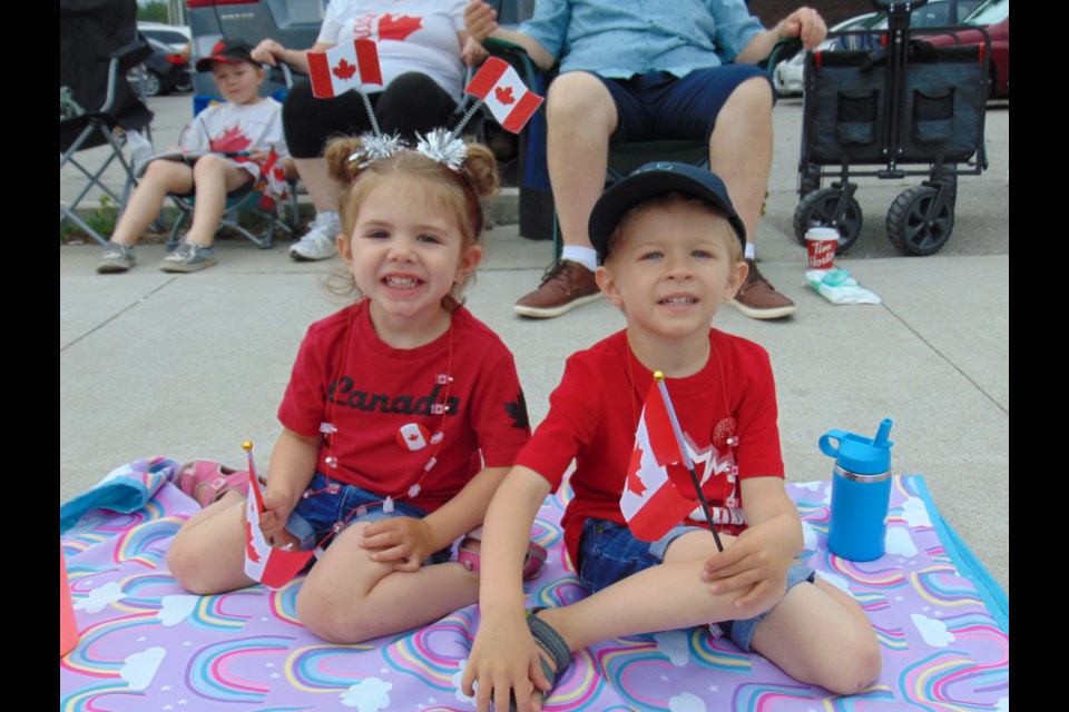 Carter and Madelyn Clemens excited for the Cambridge Canada Day Parade, 2022.                               