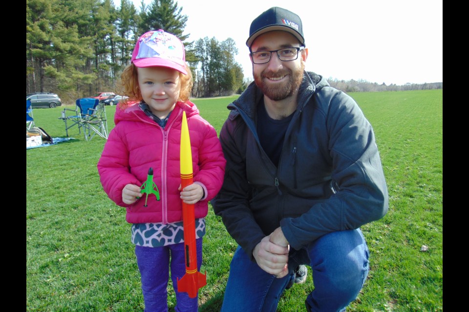 Dylan Gaspick and his daughter Andy prepare to launch at Cambridge Rocket Club's second launch of this year.                              