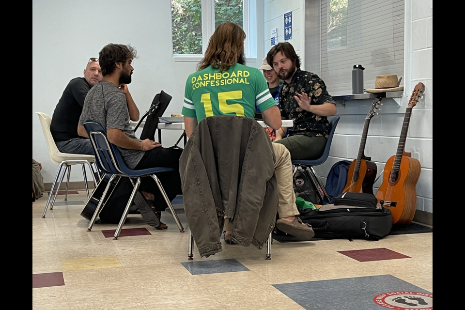 Callahan Connor, right, working with clients from The Bridges during the music therapy program offered twice a week. 