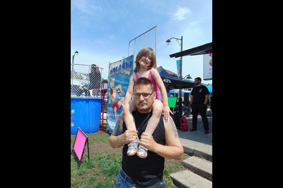 Todd Johns, owner of Wuddup Dog with his daughter, Ryleigh.                              