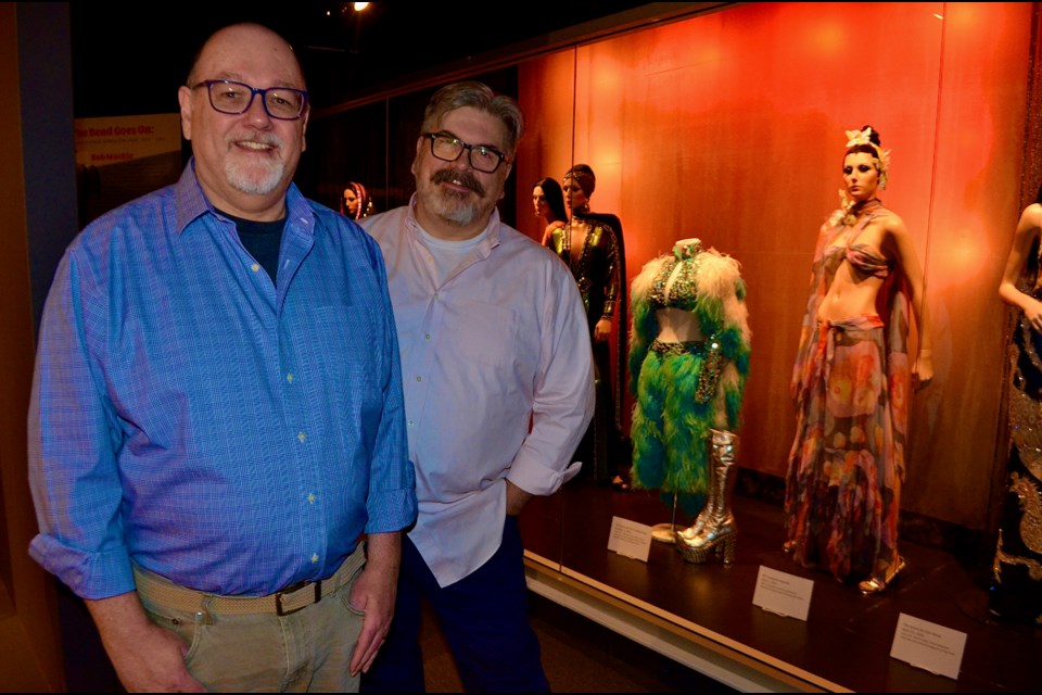 FHM founders Kenn Norman and Jonathan Walford next to the new Cher exhibit