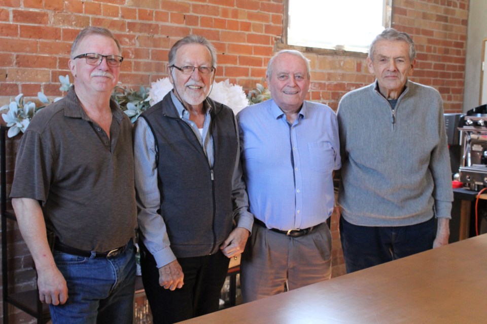 Dave Brodhagen (left), Norm Steele, Bob McBlain and Ray Miske are members of the PROBUS Club of Cambridge, a group that strives to create social connections among retired members of the community.