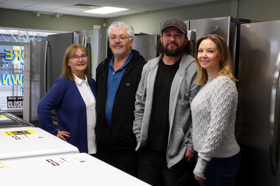 Tena Chaves (left), husband Joe, son Brad and his wife Angie are getting ready to close their 44 year-old appliance business on May 31.