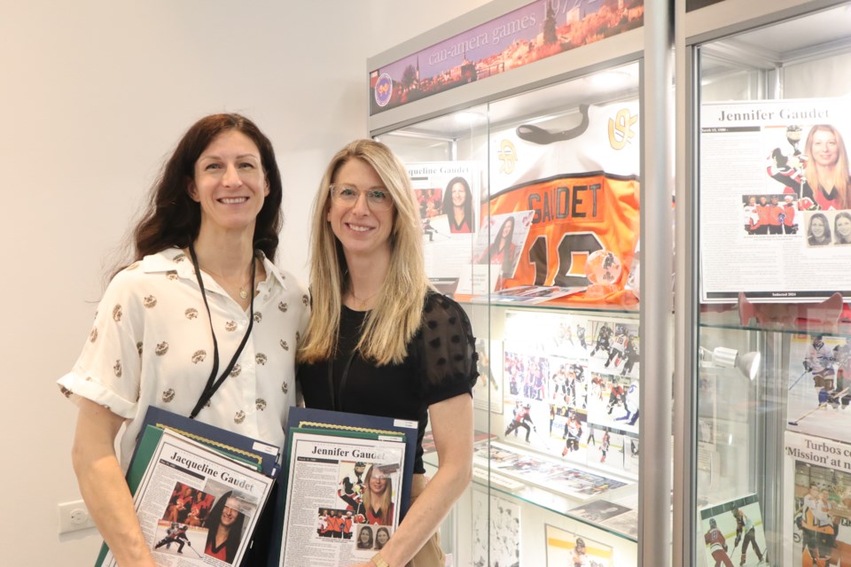 Jennifer and Jaqueline Gaudet stand next to their newly installed display  
