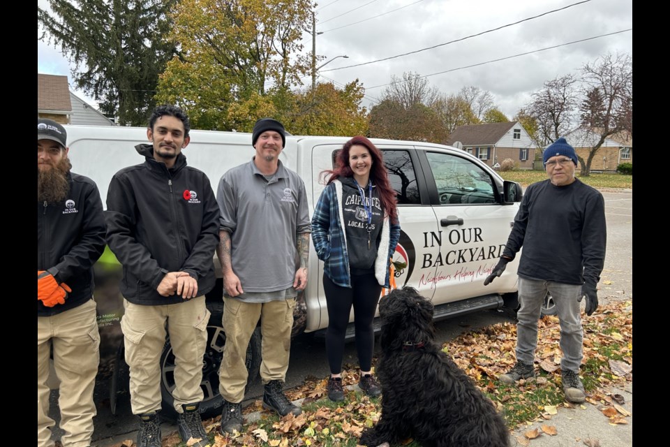 MPP for Kitchener South-Hespeler, Jess Dixon, gets to work with a crew from In Our Backyard. 