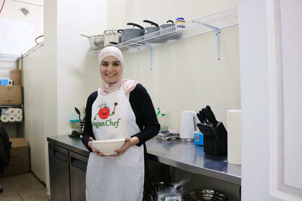 Hiba Sadi poses in her commercial kitchen on 990 Bishop St. N.