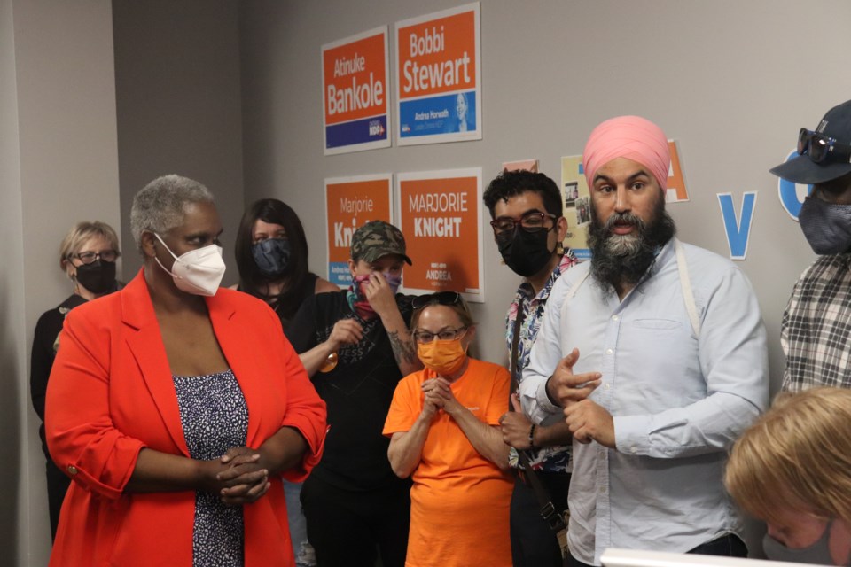 NDP leader Jagmeet Singh and candidate Marjorie Knight talk to a room full of supporters at Knight's office in Cambridge