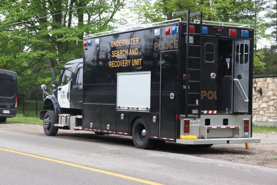 OPP underwater search and recovery van sits outside a property on Townline Road where police continue to search for a missing man.