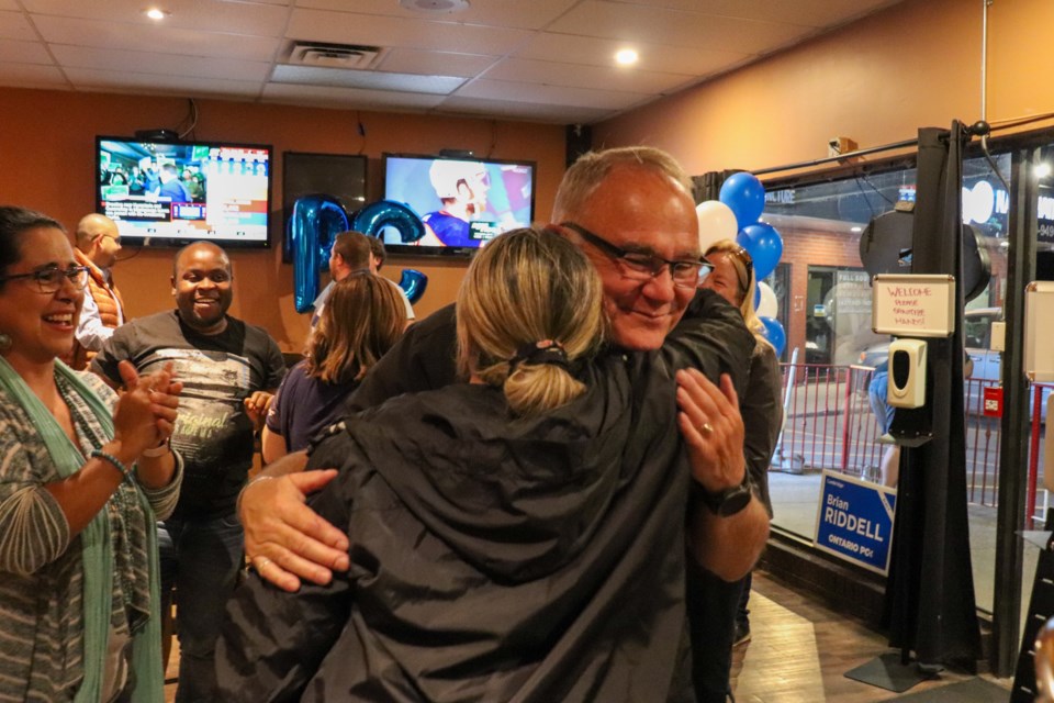 Brian Riddell is embraced by his supporters after election win as the riding's new MPP.