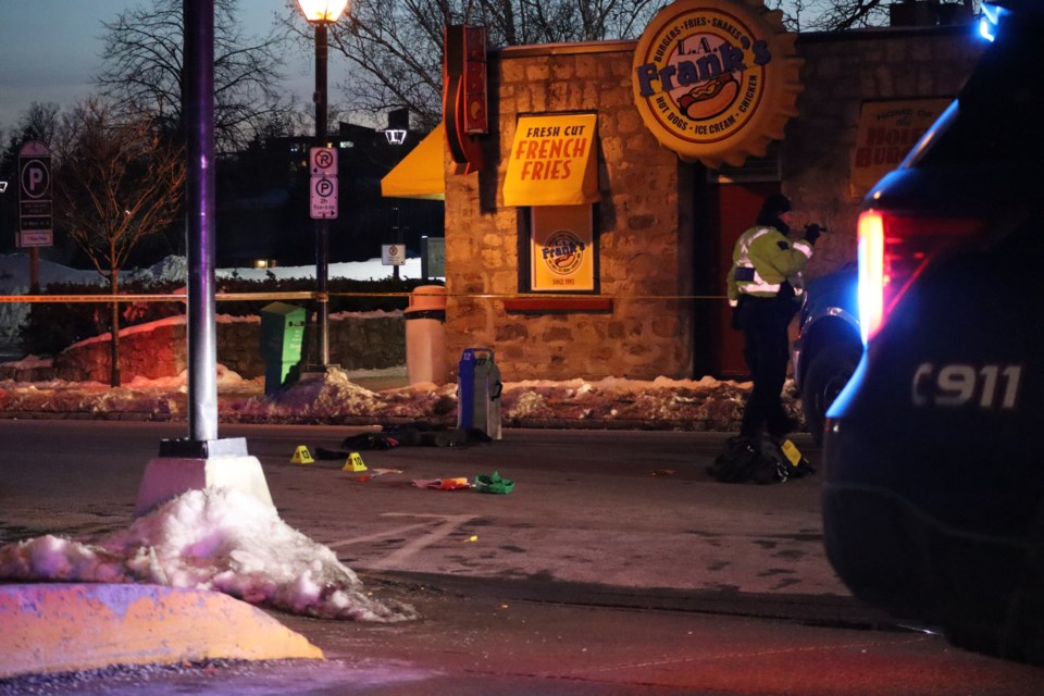 Police mark off belongings of a pedestrian who was hit by a truck on Water Street