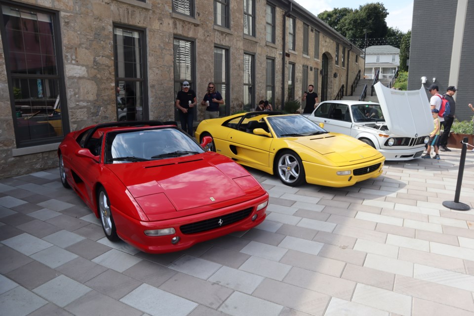 Matching red and yellow Ferraris bring all the 'Magnum PI' vibes to the Gaslight District charity car show
