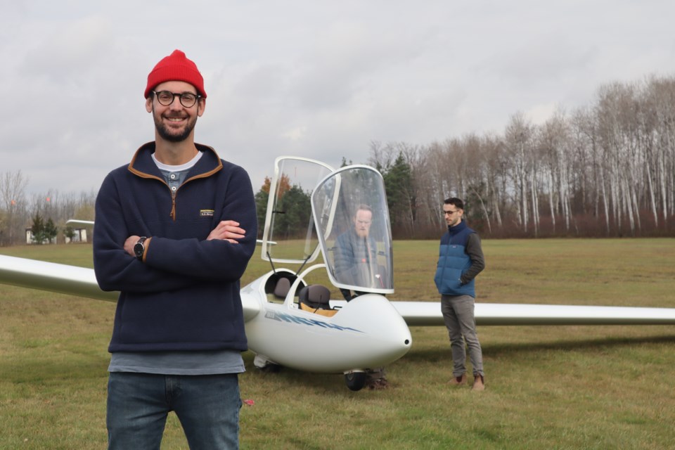 James Wood stands in front of a glider as they prepare to take off.