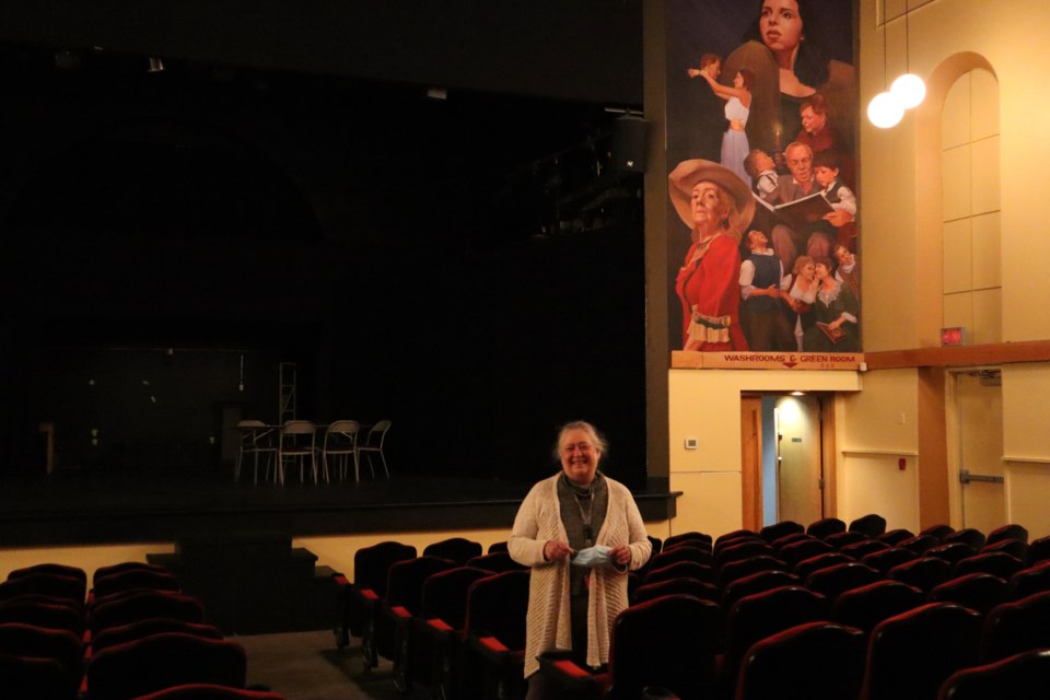 Cambridge Community Players board chair Mallory Moxon-Carson stands amid the empty seats the Players hope to fill again soon. The new seats, which include drink holders, came from the famed Grauman's Chinese Theatre in Los Angeles via the Frederick Twin Cinema in Kitchener after it closed in 2019.