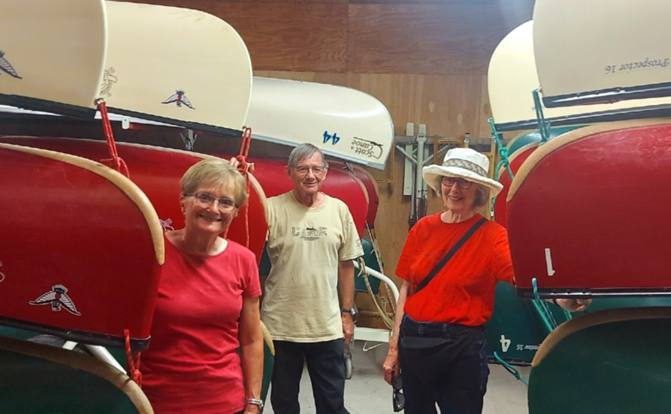 The Ancient Mariners Canoe Club of Cambridge, Lynda and Arthur Alyea, as well as Lorna Ferguson stand next to some of their canoes in Galt.