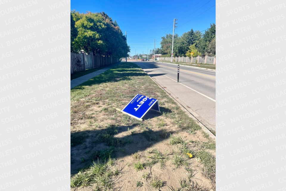 One of mayoral candidate Jan Liggett's election signs was snapped in half.