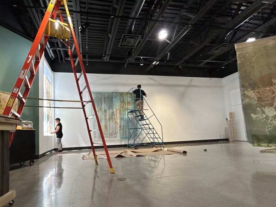 20240507-judy-major-girardin-and-exhibition-coordinator-installing-shallows-at-queens-square-gallery-cambridge-art-galleries-photo-by-alix-voz