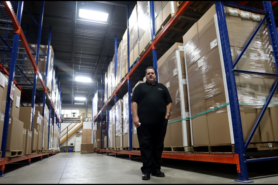 Eclipse Innovations general manager Rob Shwery stands in the company's Thompson Drive warehouse surrounded by thousands of respirators the company can't find a buyer for because of certification issues and mismanaged procurement by the province, some of which was recently addressed by Ontario's auditor general.