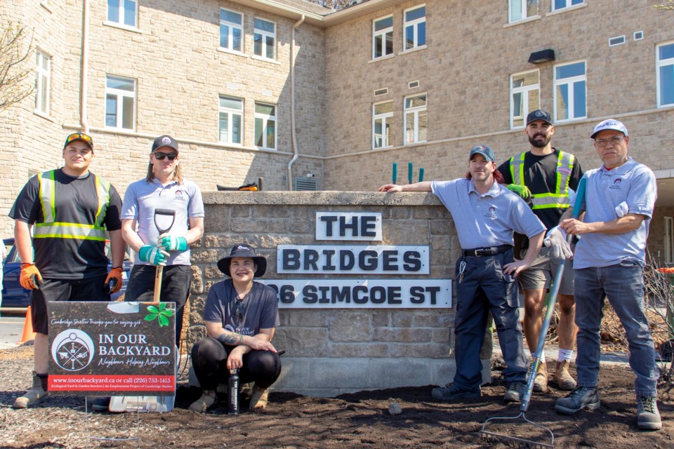 The In Our Backyard team outside of The Bridges shelter in Cambridge.