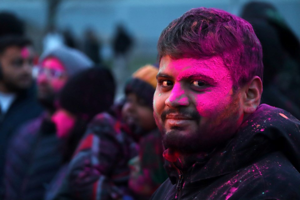The Gujarati Hindu Society of Cambridge celebrated Holi and Holika Dahan, the festival of colour, in Riverside Park on Sunday. Close to 400 attended the first outdoor Holi event in the city. Celebrated on the last full moon of the Hindu Luni solar calendar, the event invites participants to circle a bonfire doused in coloured powder, sing, dance and pray to signify the victory of good over evil.