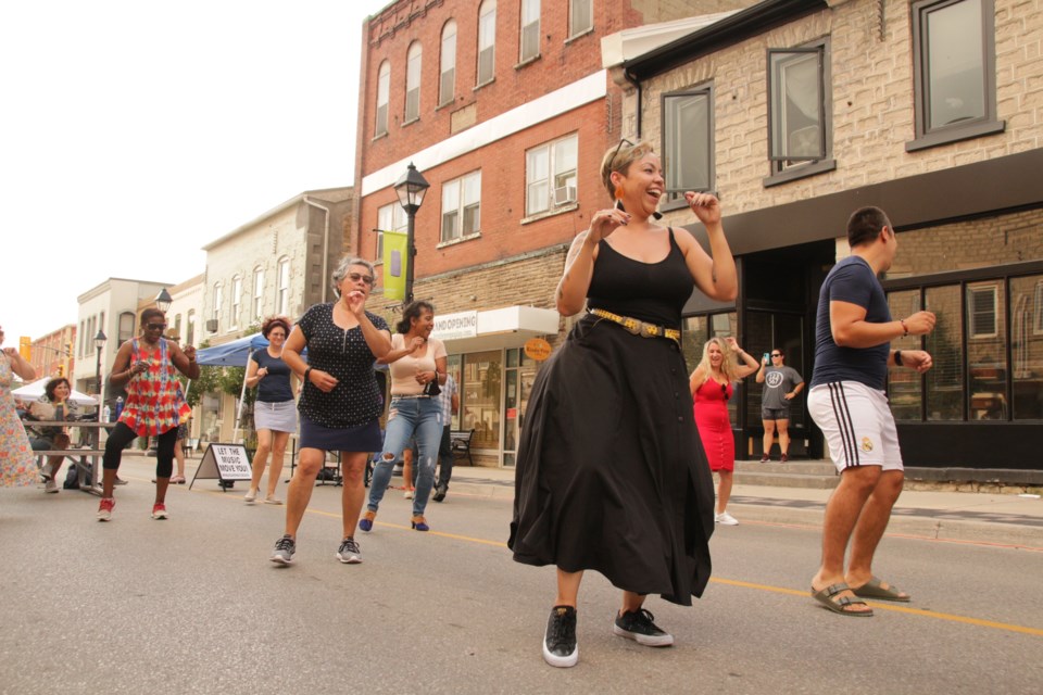 People danced to Latin music on Queen Street this weekend.