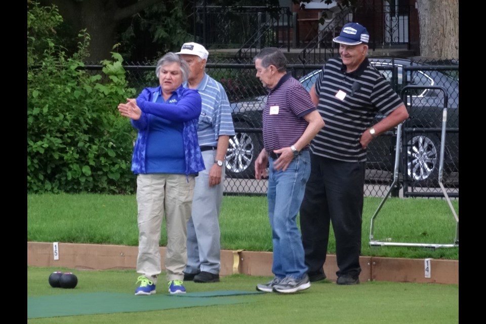 Kathy Greener, a certified lawn bowling coach, teaches visitors to the club how to play.
