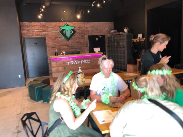 seniors enjoy a board game at trapped escape rooms and games in guelph