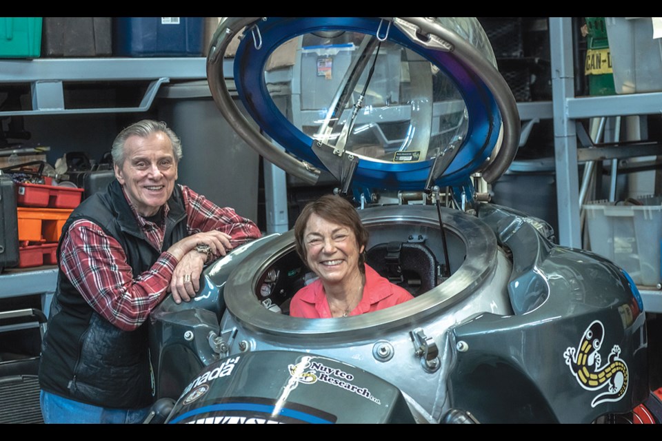 Phil Nuytten with Vickie Jensen in DeepWorker submersible.