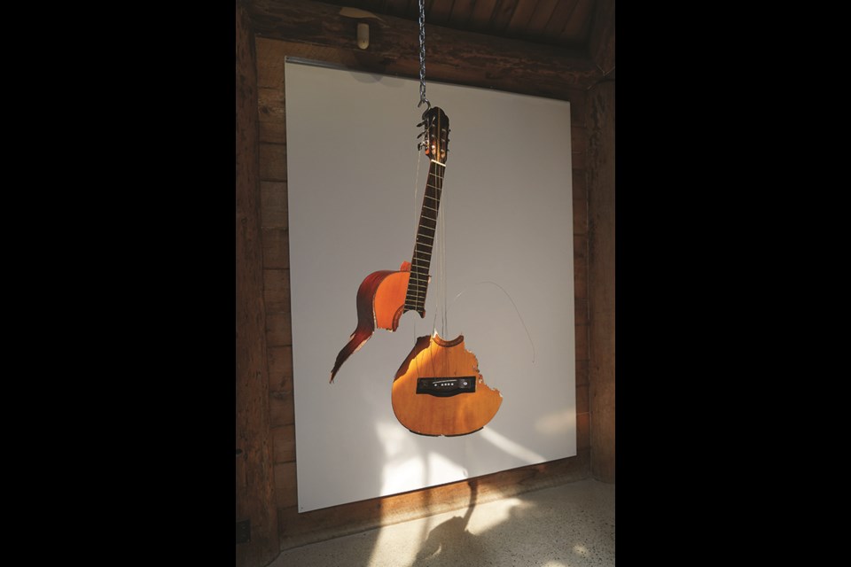 A broken guitar was among the discarded objects artist Pippa Lattey found on a Sunshine Coast sojourn in May.