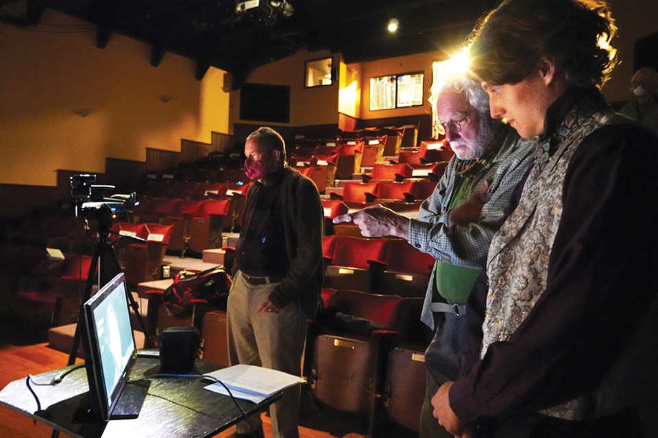 Videographer Murray Peterson, left, waits while director Mac Dodge and actor Gabe Ryan review one of Ryan’s takes playing Walter Simmons in Spoon River.