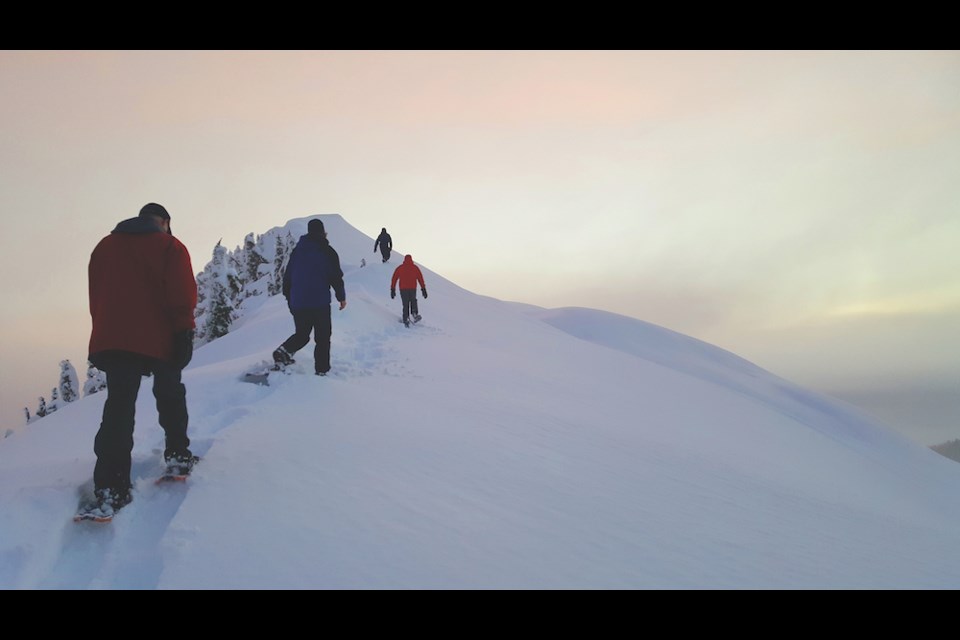 Snowshoers ascend the final ridge to Mount Steele, 5,114 feet above the Sunshine Coast shoreline but just a short climb from Steele Cabin – one of four cabins lovingly maintained by the Tetrahedron Outdoor Club.